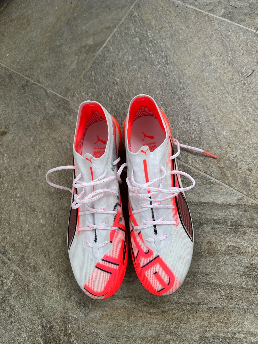 Puma White and Neon Coral Soccer Cleats